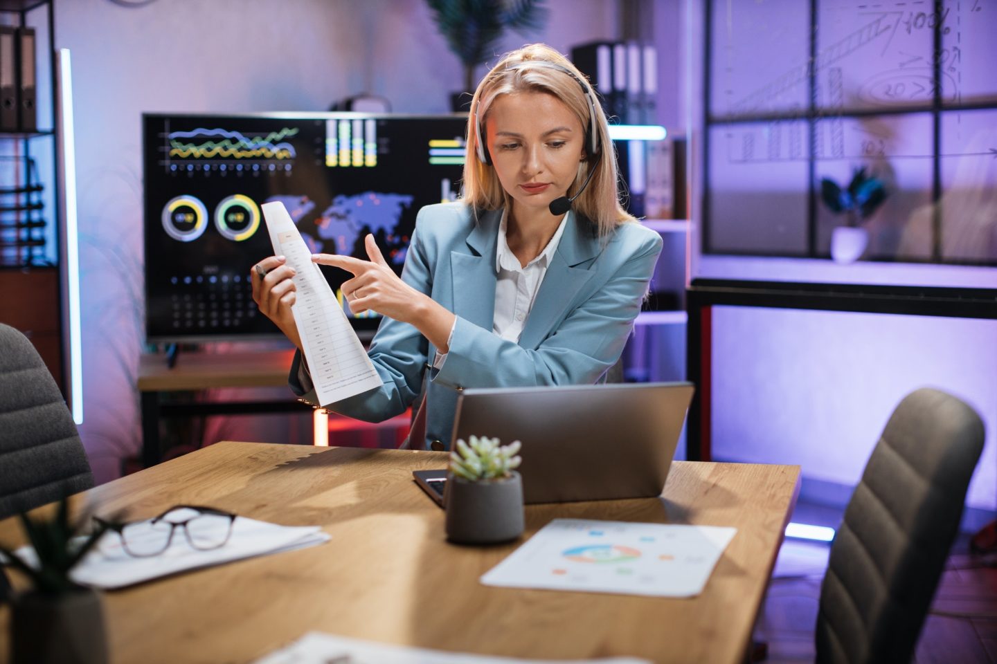 business-woman-using-headset-and-laptop-for-video-call-e1658029692465.jpg